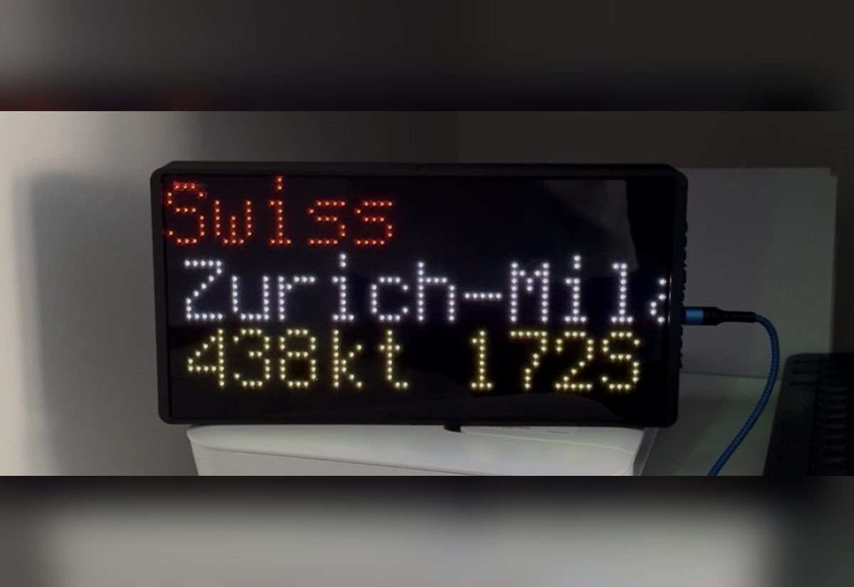 NearestPlane display on a desk showing a Swiss flight from Zurich to Milan at 438 knots