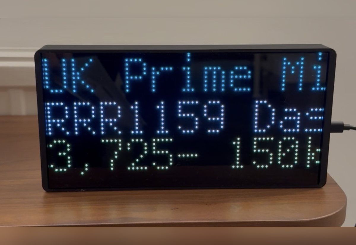 NearestPlane display on a side table naming the UK Prime Minister's flight, RRR1159, passing at 3,725 feet